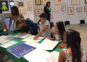 Exploring stencil leaf rubbings in graphite and colored pencil at The Huntington. Photo © Janice Sharp, 2015.